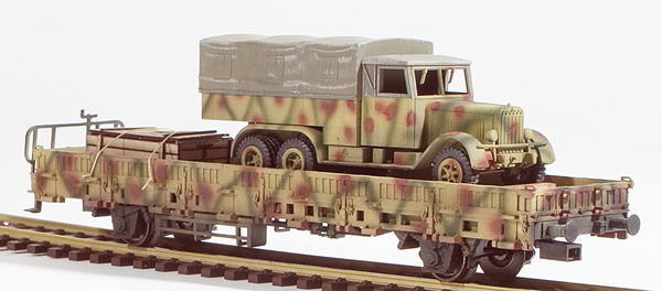 REI Models 46941SAC - German WWII Henschel 33  in Ambush Camo loaded on a 2 axle DRB stack car  